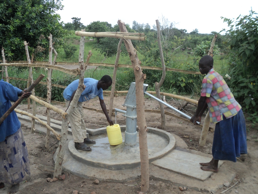 Susan Akello of Te- Akang pumping their new well